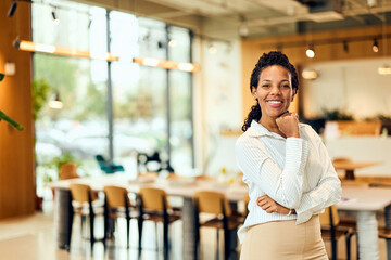 African-American Woman In Modern Office Space Exuding Confidence And Professionalism