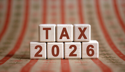 Numbers 2026 and text TAX on cubes on a ornament background