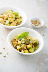 Chicken with celery, zucchini and pine nuts