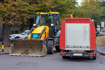 Industrial machines for maintenance and other construction works outside on urban city construction site