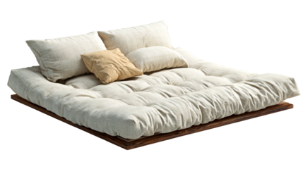 Plush futon mattress with pillows on dark wood base