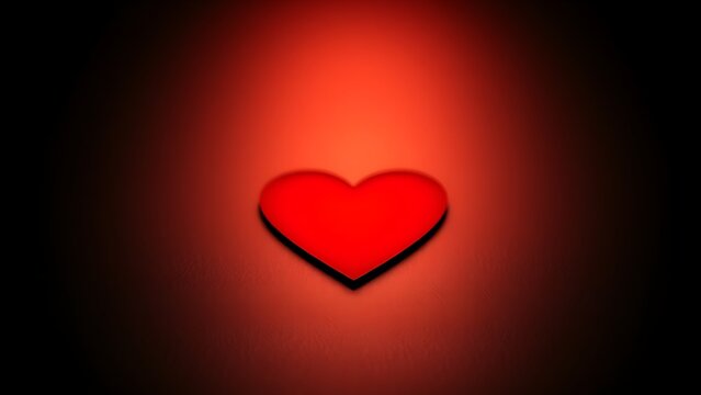 Red heart shape on a sleek black surface, radiating warmth and emotion with a minimalist aesthetic.