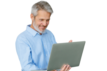 Smiling mature man with grey hair and beard engaging with portable technology, using a laptop. Transparent background