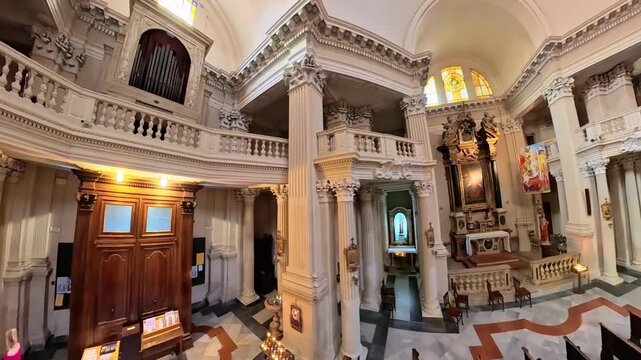 Modena, Italy - Oct 25, 2025: 360 top view of Ornate Baroque interior of San Giorgio Church in Modena, showcasing gilded altar, vaulted frescoed ceiling, marble columns and nave of St George church