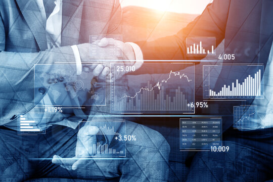 Professional business partnership handshake over digital financial charts symbolizes collaboration and commitment to success in today corporate world. Scalp
