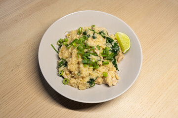 Sticky rice with chicken and spinach.