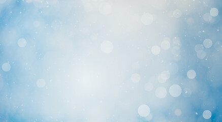 light blue winter background with defocused lights (bokeh)
