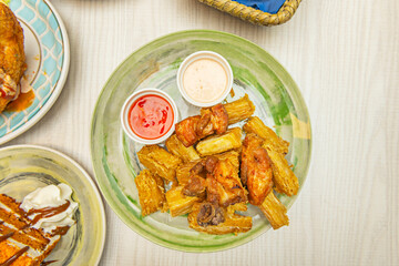 Caribbean-style fried yuca with a Creole mojo sauce of sour orange, garlic, and pickled red onion on the side