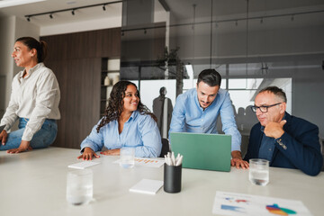 Multigenerational business people sharing ideas inside company office - Multiracial colleagues discussing new financial project - Brainstorming and corporate concept - Main focus on center man face