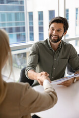 Positive handsome company leader hiring new employee