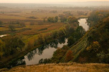 Peaceful autumn river valley seen from a high viewpoint