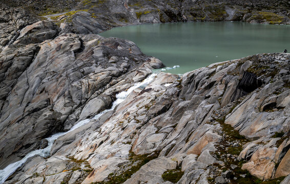 the spring and source of the river Rhone, high up in the swiss mountains suppling the iconic river going through Switzerland and France into the mediterranean  sea 