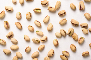 Roasted pistachios with salt, healthy snack on white background