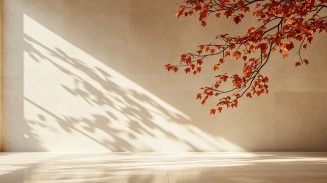 A serene interior scene with autumn leaves casting shadows on a textured wall, highlighting warm tones and minimalistic design.