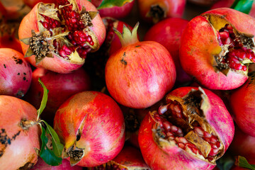 Pomegranate fruits. Open pomegranate fruit with the red seeds showing. 8K resolution.