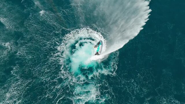 Jetski doing a water curtain backwards in blue waters
