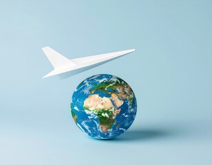Fototapeta premium Paper Plane Flying Over Globe – Minimal Travel Concept
