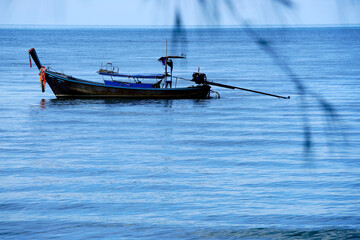 Tranquil Fishing Boat on Calm Water in Serene Coastal Scene