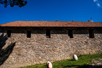 An old stone building with a tiled roof.