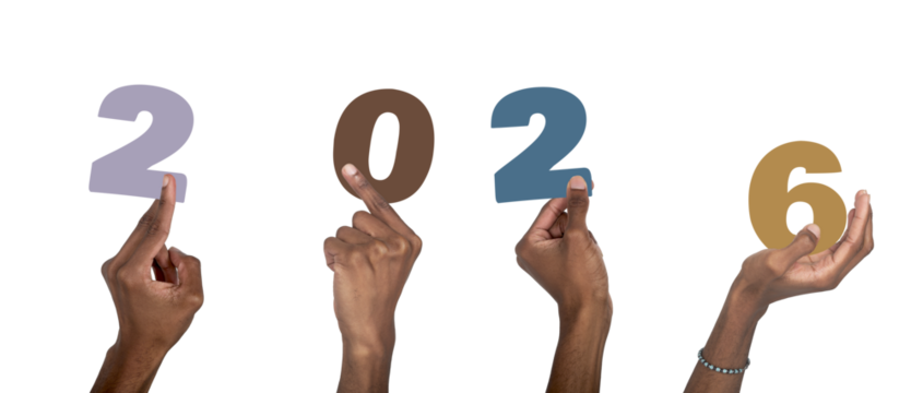 2026 New Year celebration. Dark-skinned male hand raised holding colorful multicolor numbers,