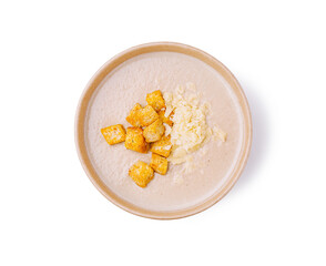 Delicious dish of creamy soup with crispy croutons and cheese served in a bowl