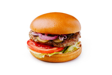 Juicy hamburger with lettuce, tomato, onions, and pickles on a soft bun