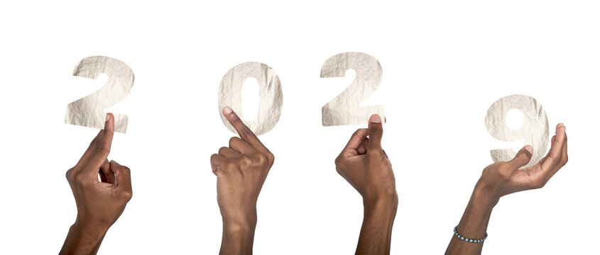 2029 new year concept of silver celebration. African American hands raised holding metallic number - Powered by Adobe