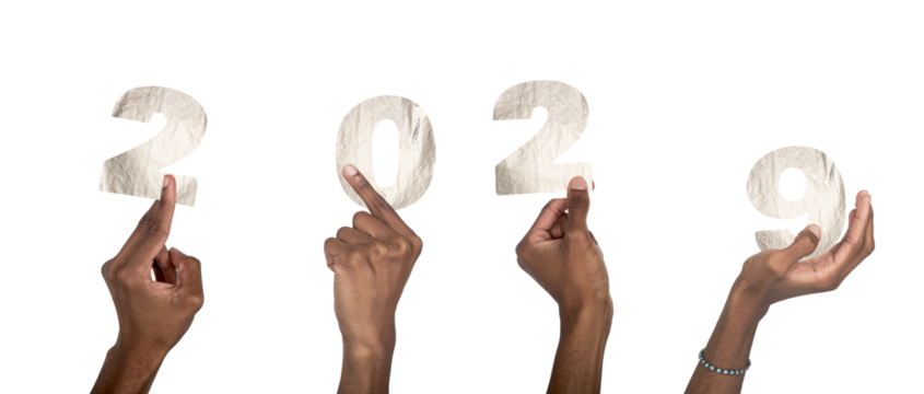 2029 new year concept of silver celebration. African American hands raised holding metallic number - Powered by Adobe