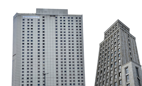 Building with classic architecture. Tall concrete skyscraper with geometric facade, gray exterior,