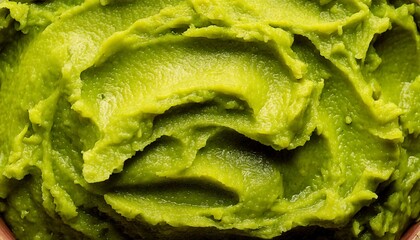 Fototapeta premium Close-up of a mashed avocado texture background