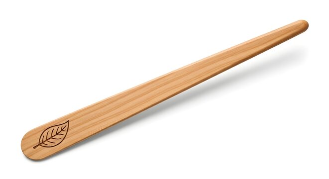 Wooden spatula with leaf symbol on white background