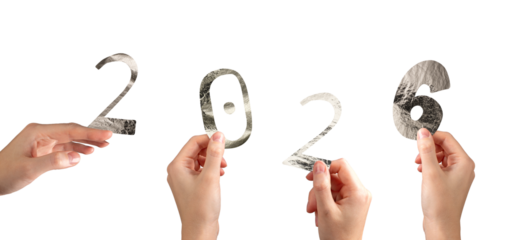 Hand holding silver metallic 2026 number in festive New Year celebration. Shiny textured foil