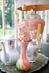 Baby shower setup with pastel balloons, cake and wrapped gifts on a cozy table, soft natural light and copy space&mdash;perfect for invitations and social posts.