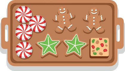 Assortment of Christmas cookies and candies on a baking tray