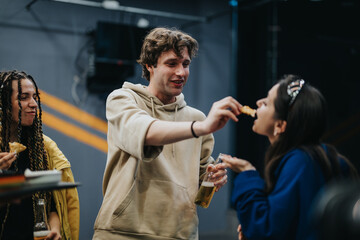 Group of young people having fun socializing, sharing food, smiling, and enjoying casual moments of connection and friendship.
