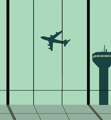 A view out of an airport window shows a plane and the control tower.