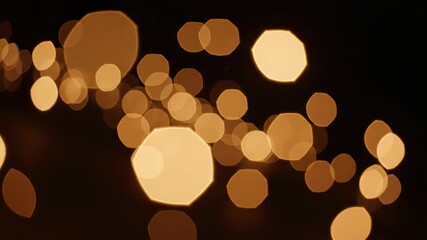 Warm, golden lights twinkle and flicker against a dark backdrop in an inviting atmosphere. The gentle glow creates a magical and peaceful scene perfect for relaxation.