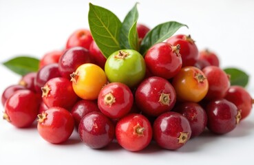 Obraz premium Fresh Camu Camu berries in various stages of ripeness. Pile of red, yellow, green Camu Camu fruits with leaves. Exotic tropical fruit rich in vitamin C and antioxidants.