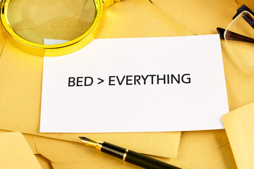 A playful message emphasizes the value of rest, as a note is placed among writing materials and magnifying glass. The bright setting suggests a creative workspace