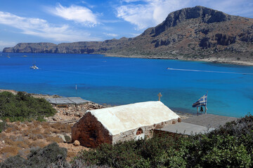 All Saints Chapel near the sandy beach of Balos Lagoon in Crete, Greece