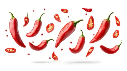 Acrylglasbilder Scharfe Chili-pfeffer Multiple vibrant red chili peppers and slices appear to float against a clean white background  © Gendar SINURO