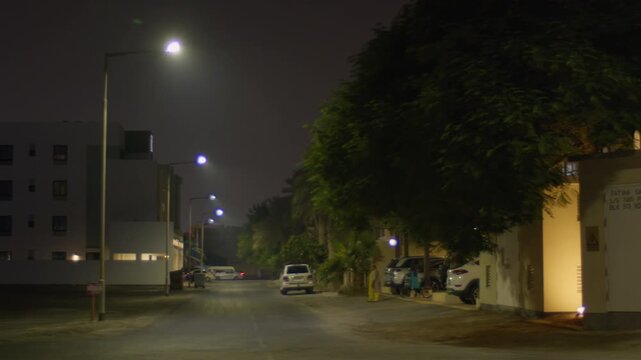 Night time in Sar, Bahrain, houses and street with light traffic