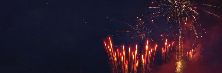 New Year, New Year's eve or festival celebration holiday greeting card long - Red firework fireworks display pyrotechnics on night sky background