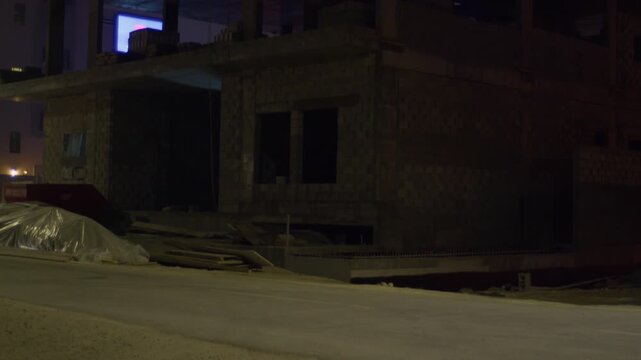 Apartment building under construction in Sar, Bahrain, night shot