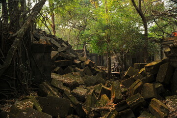 Collapsed large sandstones bridge at ruins of Beng Mealea Temple in the middle of jungle in Cambodia.