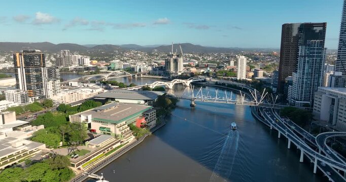 4K Aerial Locked off stationary motion of west side Brisbane CBD, known as South Bank Precinct with new buildings and new pedestrian bridge called Neville Bonner Bridge, Brisbane, QLD, Australia