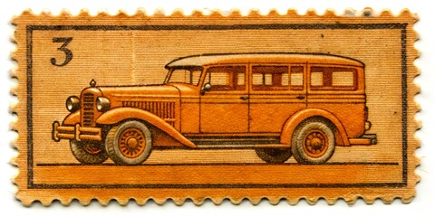 Vintage orange automobile depicted on a postage stamp