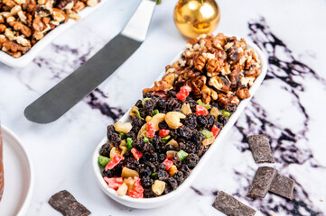 Homemade sweet bread filled with chocolate, dried fruits, walnuts, almonds, peanuts, candied nuts, raisins, and fruit, Christmas and Thanksgiving holiday bread. 