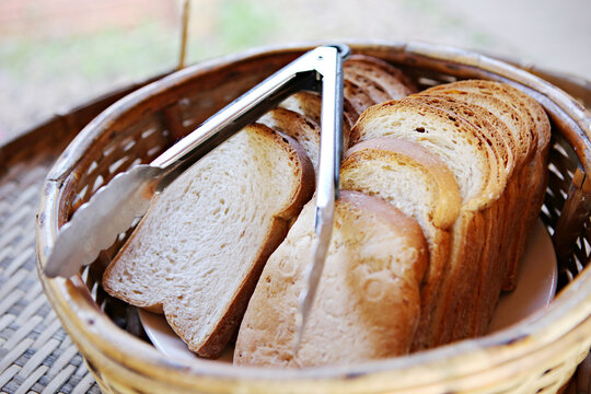 Fresh bread is sliced prepared for breakfast in basket bamboo