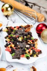 Homemade sweet bread filled with chocolate, dried fruits, walnuts, almonds, peanuts, candied nuts, raisins, and fruit, Christmas and Thanksgiving holiday bread. 